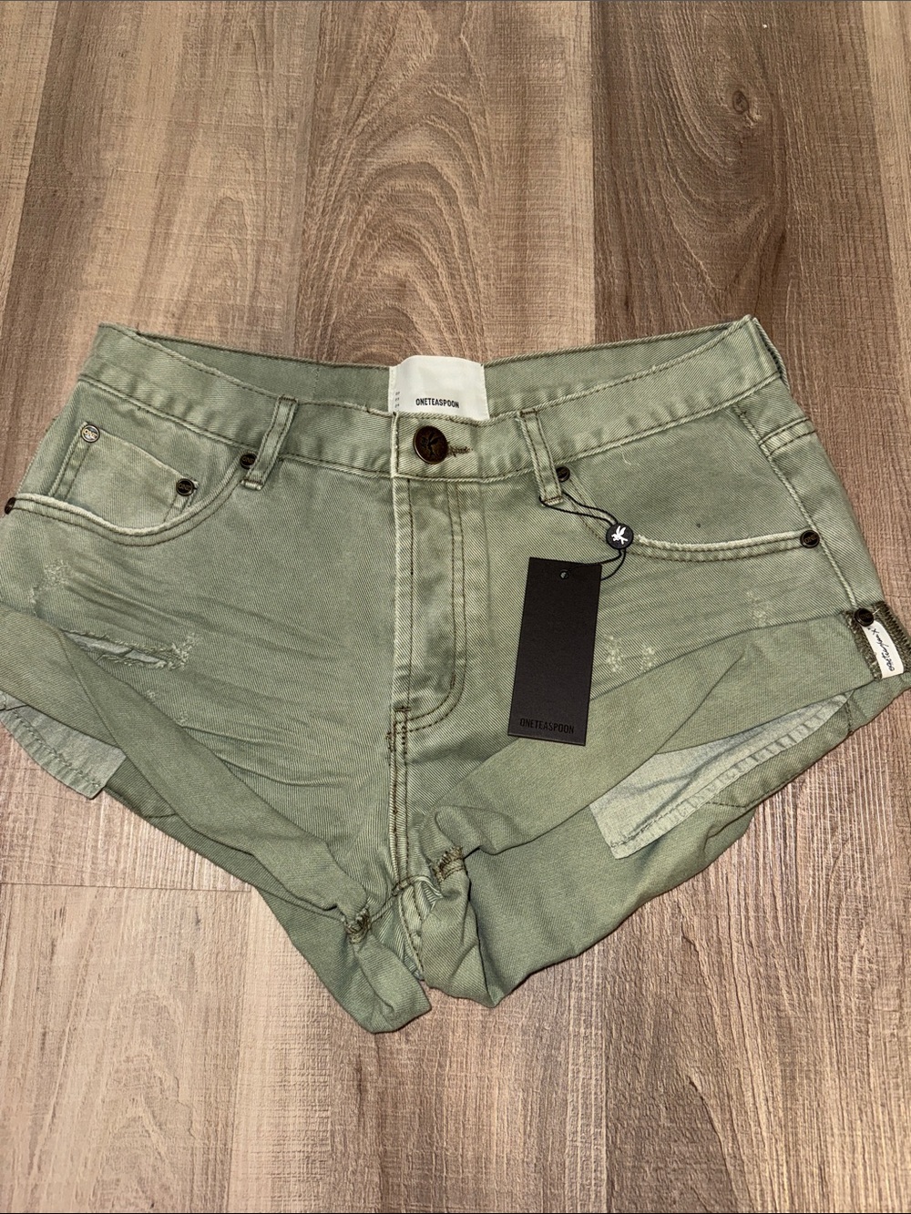 Green Denim Cutoff Shorts by ONETEASPOON